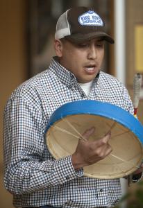 Aaron Brien drums and sings before the announcement of the Elouise Cobell Land and Culture Institute.